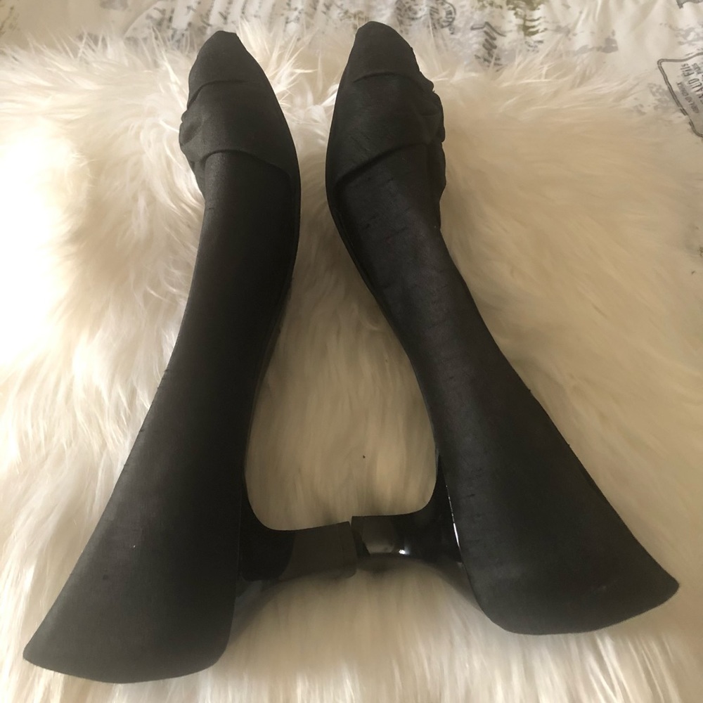 Slightly used women peep toe shoes with 2 inch heels.